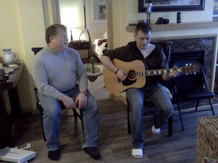 David and his dad singing Christmas carols