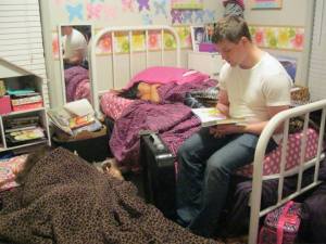 David reading to his little sisters