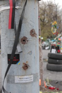 Bullet-holes in a telephone pole.